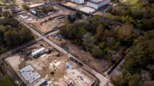 An aerial view of a construction site with trees.